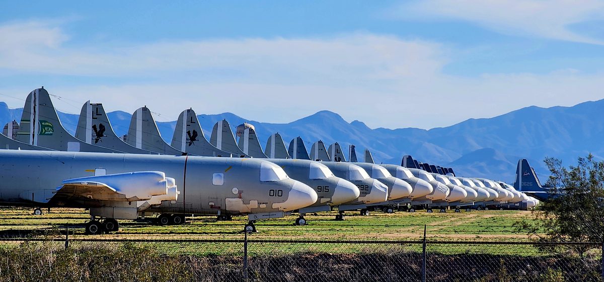 Rows of retired aircraft lined up in the Arizona desert boneyard