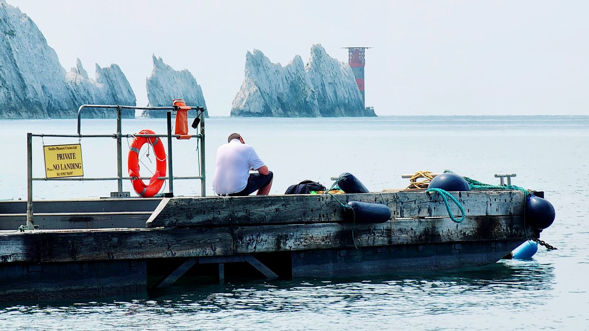A boat deck heading toward The Needles chalk stacks off the Isle of Wight