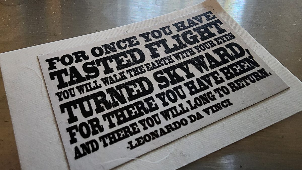 A printed card with Leonardo da Vinci's quote about tasting flight