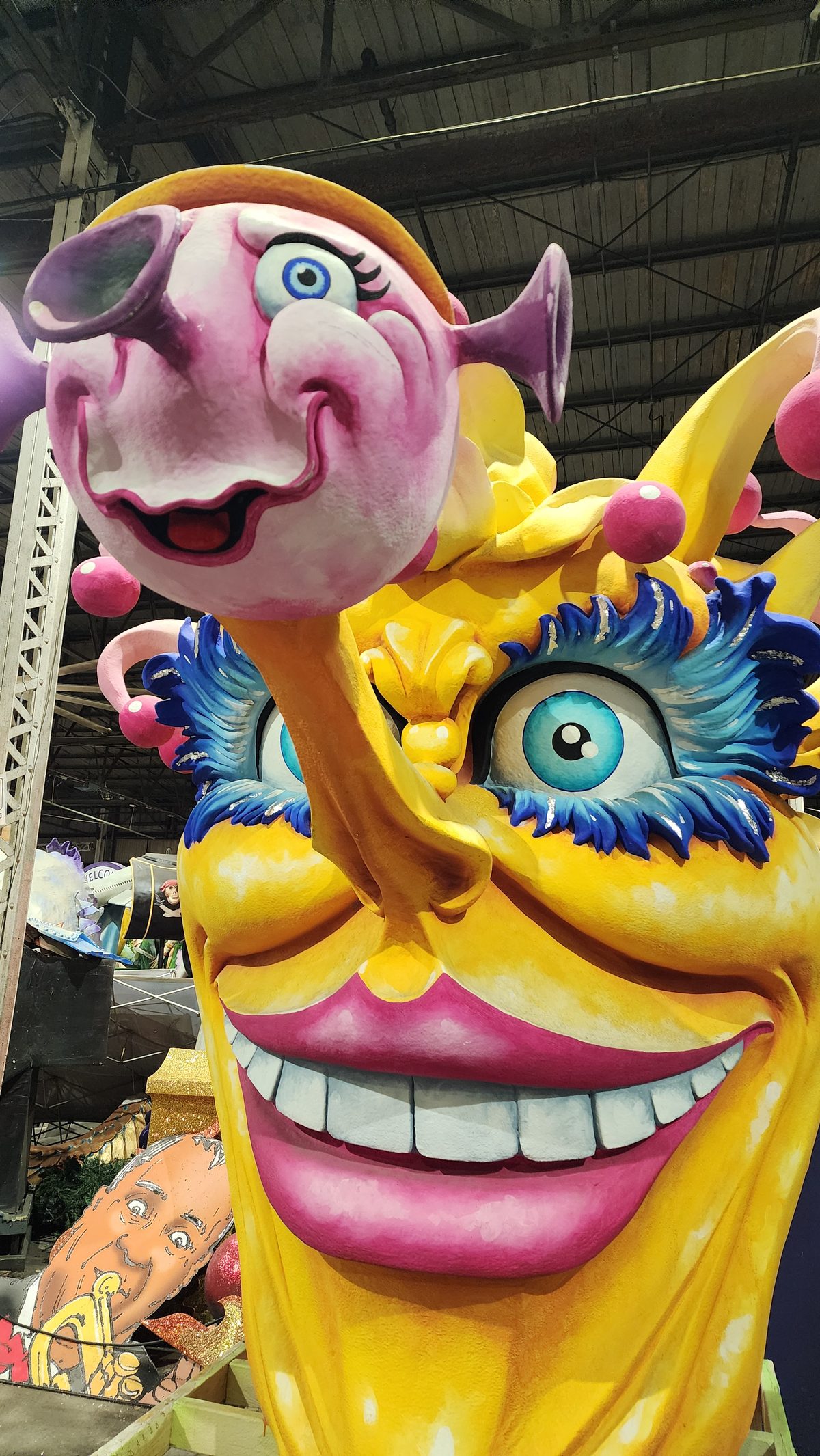 A giant smiling jester face from a Mardi Gras float in New Orleans