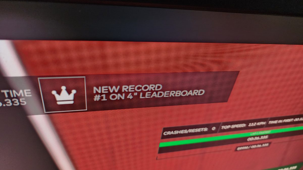 A game screen showing a new record message
