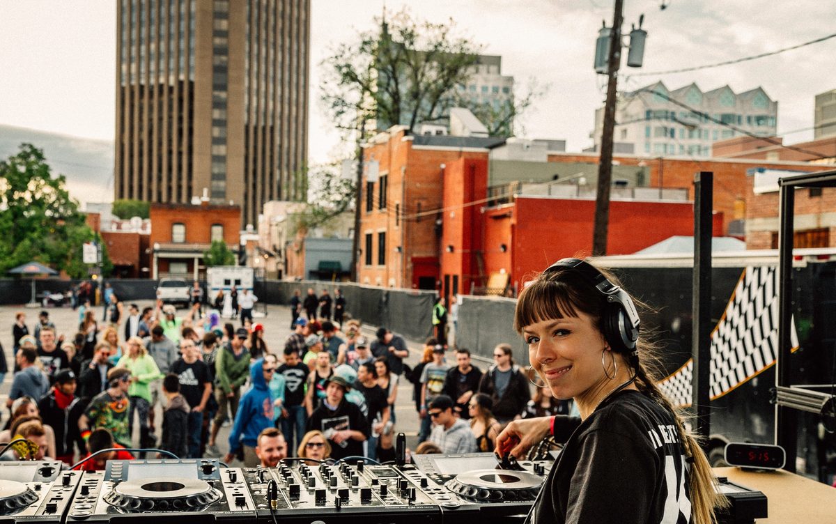 DJ Reid Speed smiles over her shoulder at a packed crowd during her set at Gravity festival in Boise.