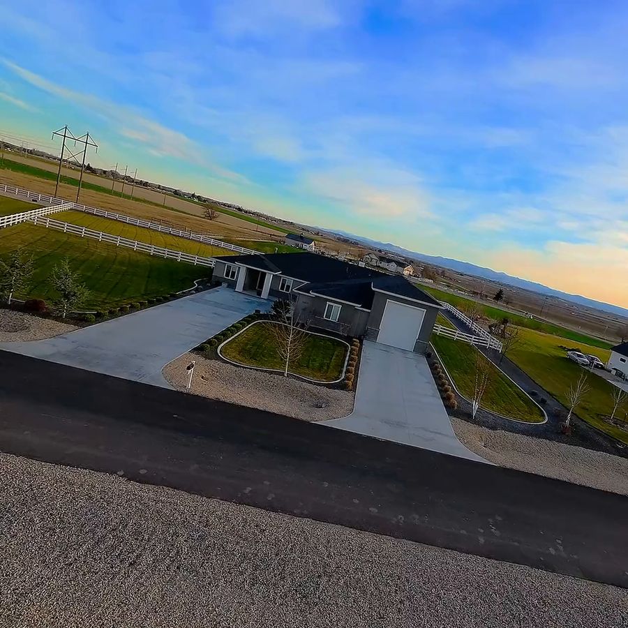 FPV drone flies through the front door of a single-story country home