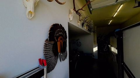 FPV drone flies out of an RV garage and through a home toward the hot tub